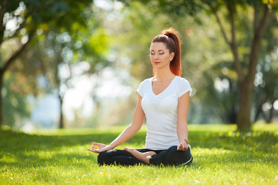 bigstock-Yoga-outdoor-Happy-woman-doin-172357406